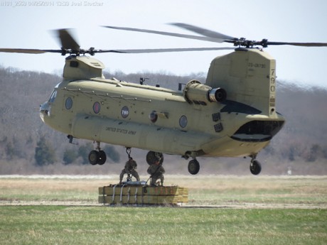 Connecticut Army National Guard helicopter takes off at Groton-New London Airport with a pallet of lumber for Great Gull Island. Photo by Joel Stocker/UConn Extension.
