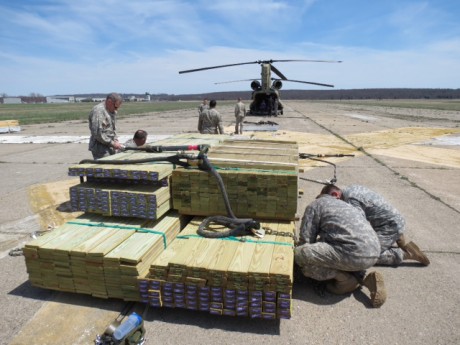 National Guardsmen pack the pallets of lumber at Groton-New London Airport. Photo by Joel Stocker.