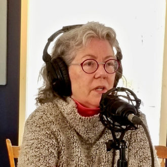 Judy Preston, the Long Island Sound Study Outreach Coordinator, is talking into a microphone at the iCRV internet radio station.