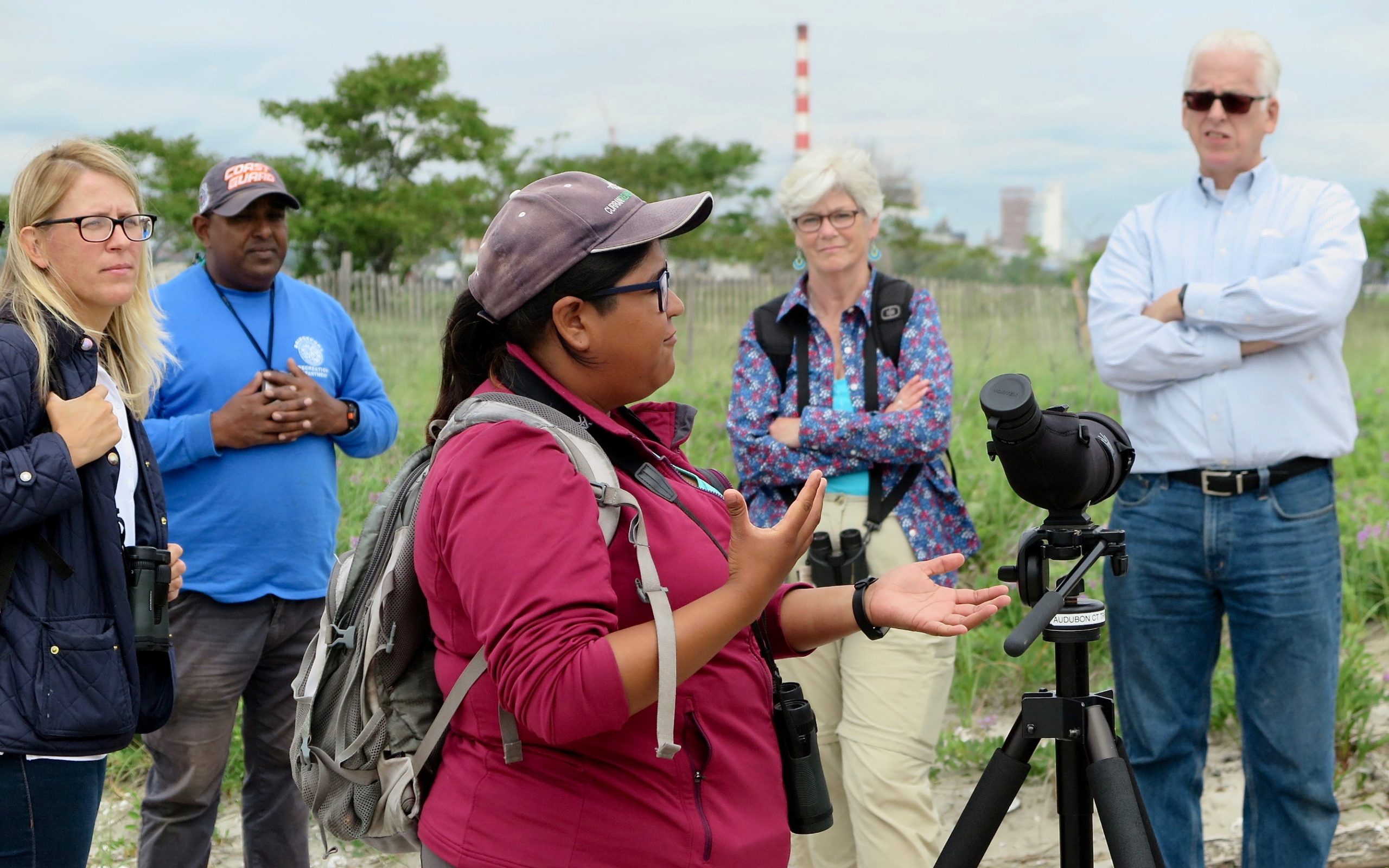 A resource manager at Audubon Connecticut discusses coastal bird monitoring to the Citizens Advisory Committee at Pleasure Beach in Bridgeport, CT.