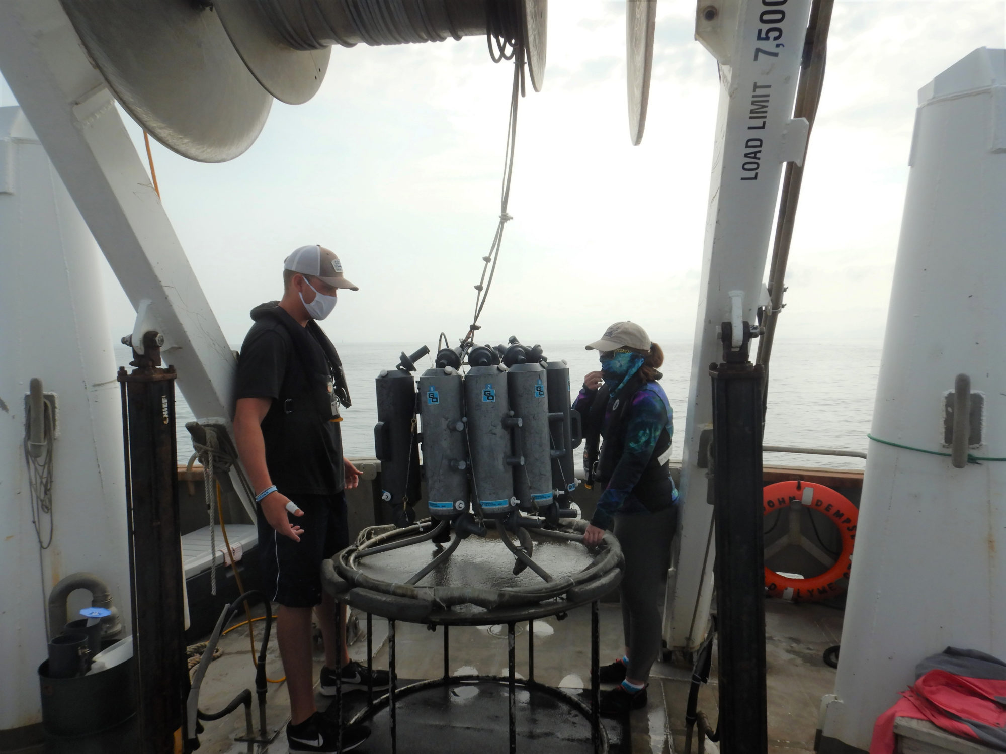 CT DEEP seasonal staff prepare to deploy a rosette sampling array into the Sound to collect water samples and test for oxygen-depleted water in the bottom water of Long Island Sound. 