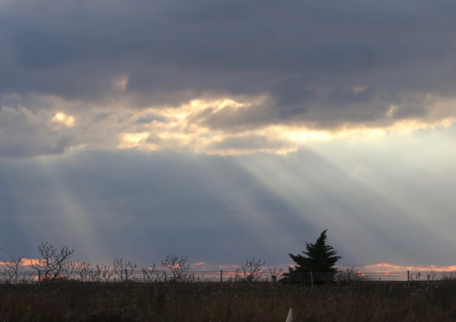 Sunlight streaming through clouds at Great Meadows Marsh.