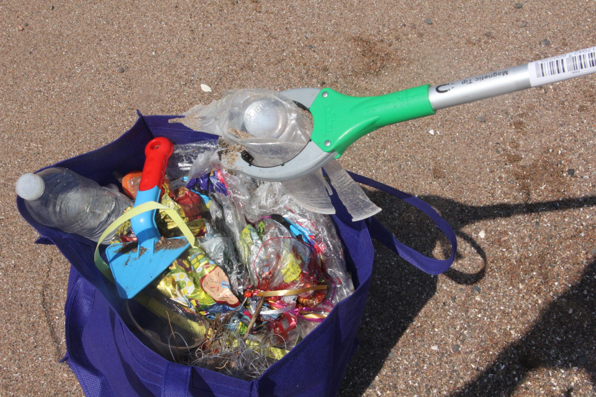 A bag full of plastic balloons, water bottles and monofilament fishing line were and other trash picked up at a volunteer cleanup in Lighthouse Point Park in New Haven in 2018.