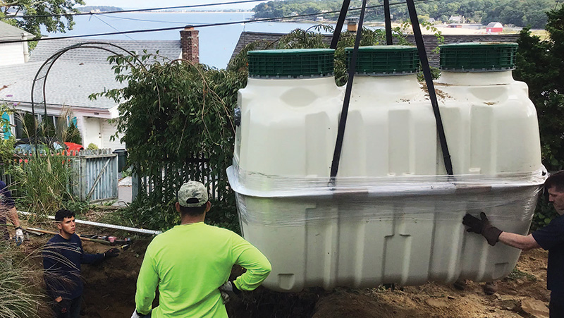 A house in Centerport Harbor gets an enhanced nitrogen removal septic system to replace a cesspool. Jim Ammerman/LISS photo