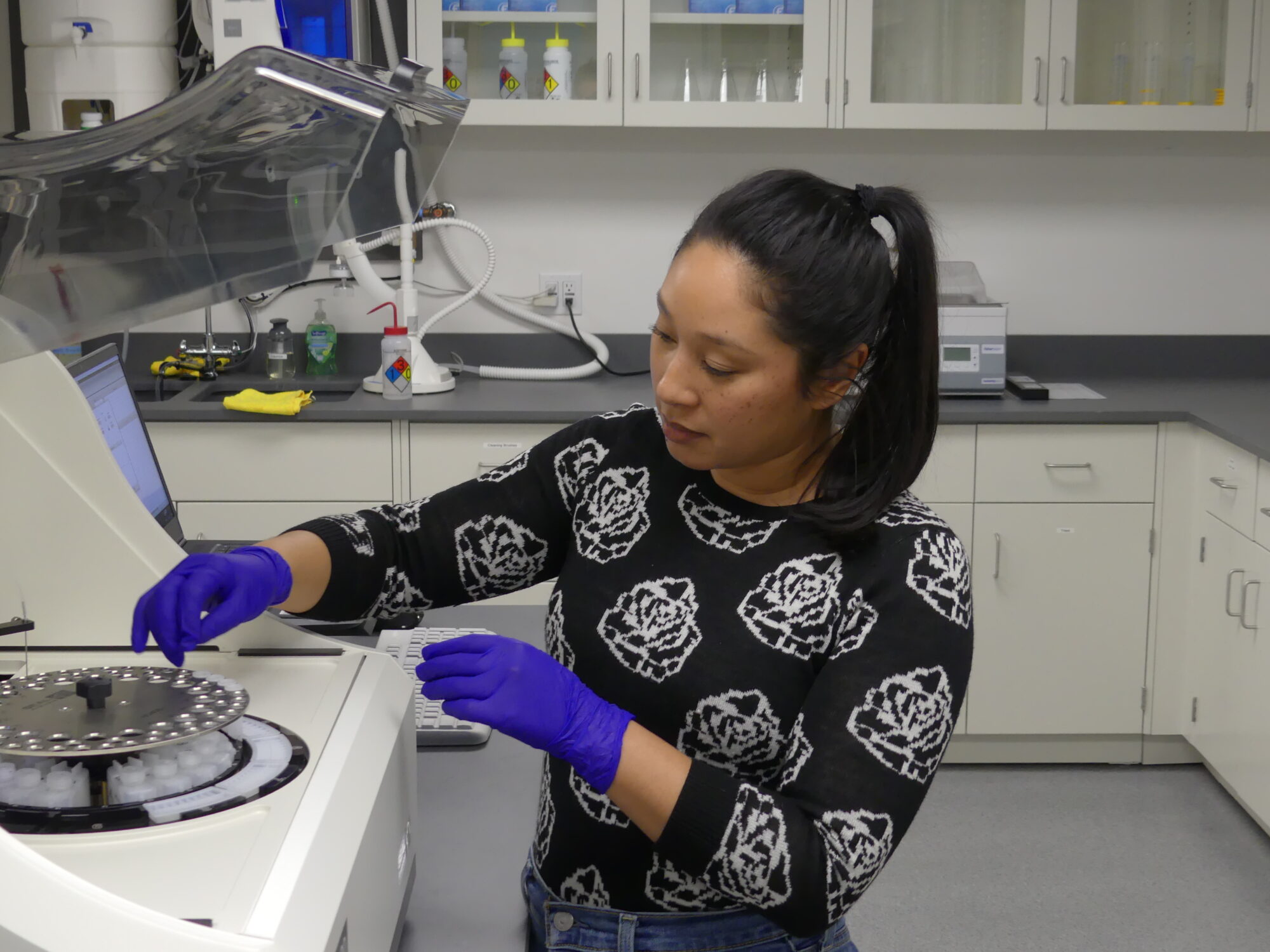 Elena Colon, Laboratory Manager at Save the Sound's laboratory in Larchmont, New York, places sample cups into the facility's new discrete analyzer. 