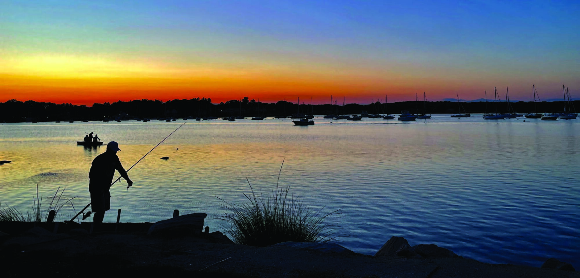 An angler fishing on North Cove in Old Saybrook, CT. BIL funds will be used to reach out to non-English speakers for the state's annual angler survey. Photo by Ann Talbot/IStock
