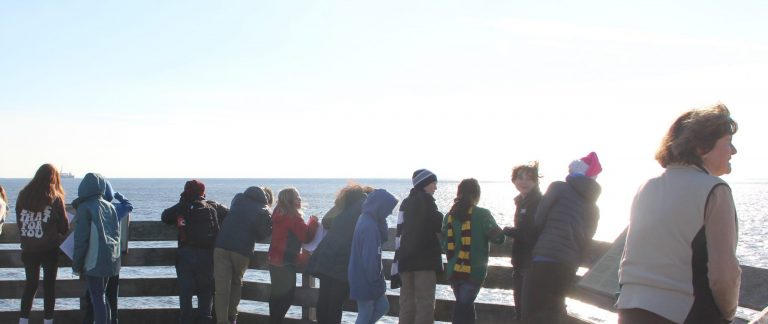 A group of middle school students and their teacher on an observation deck overlooking Long Island Sound. Photo courtesy of CT Sea Grant.