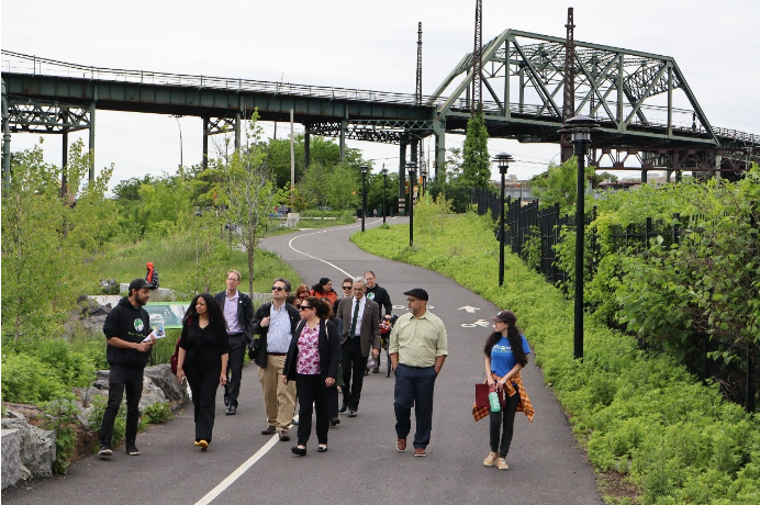 People walk the road in an urban park. 